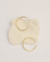 Brass Full Moon Mini Hoop Earrings by Moneh Brisel